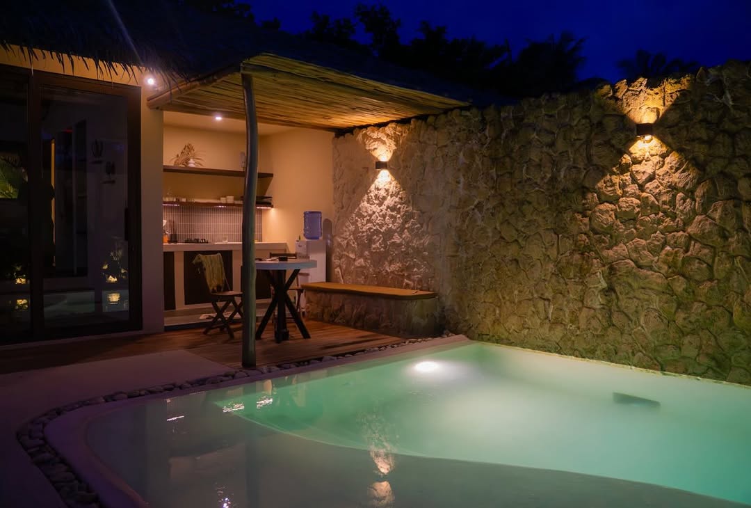 Nala Villas — night view, warm evening lighting at the villa